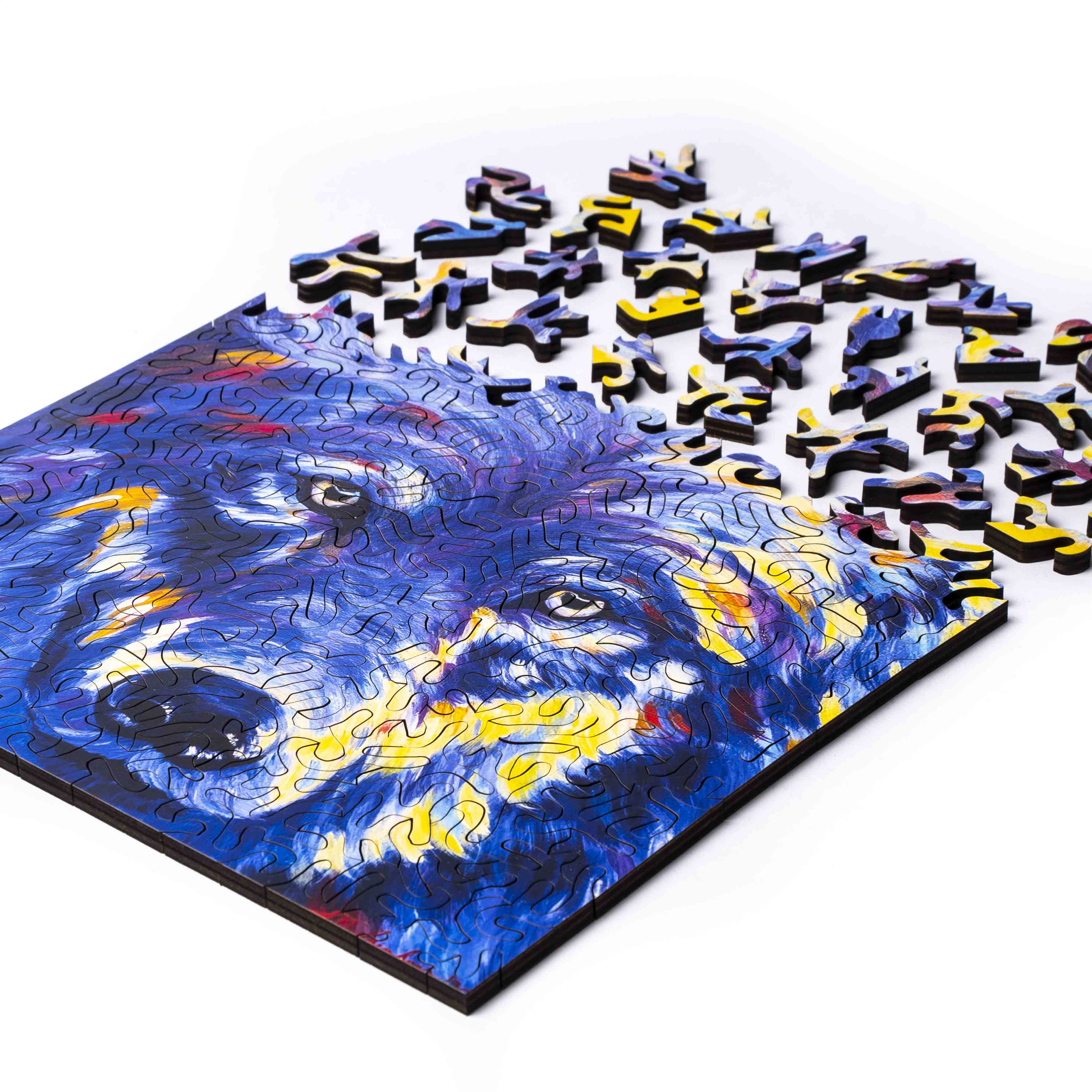 Wild Wolf wood jigsaw puzzle by Mandy Leinbach featuring detailed wolf artwork on interlocking wooden pieces.
