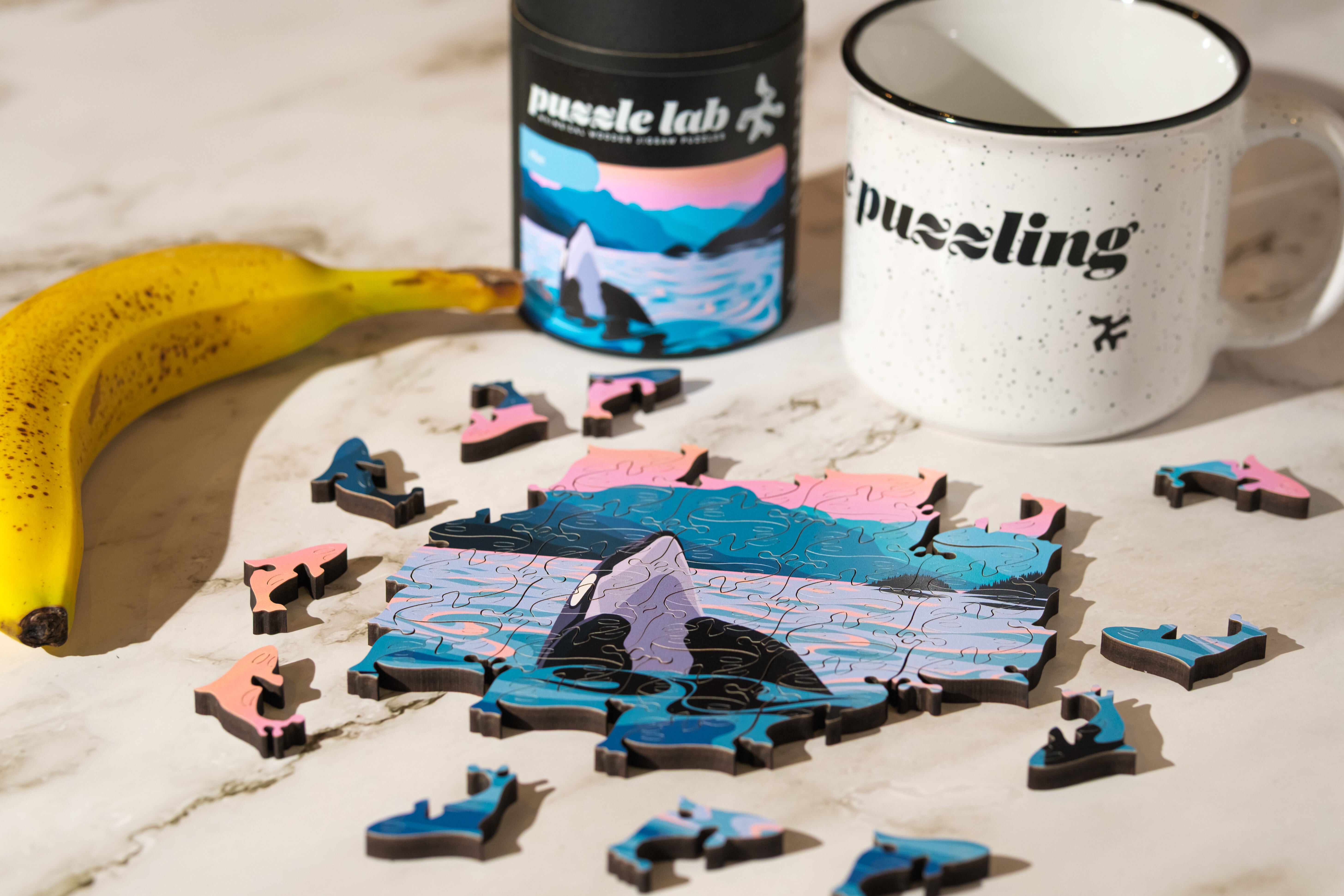 Art by Di Rise Mini Wood Jigsaw Puzzle featuring colorful, interlocking wooden pieces on a white background.