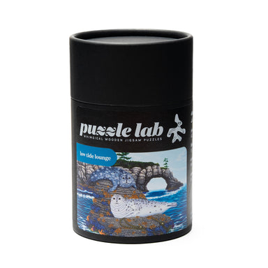 Mini wood jigsaw puzzle by Mike Semkiw featuring a Low Tide Lounge scene, with colorful puzzle pieces on a wooden surface.