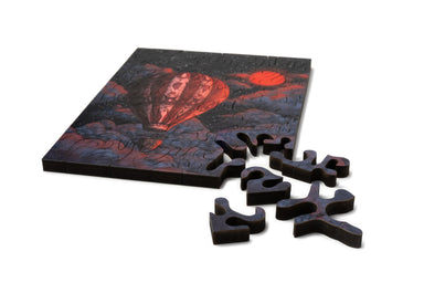 Mini wood jigsaw puzzle titled "Adventure Awaits" by Ella Mazur, featuring vibrant, detailed puzzle pieces on a light background.
